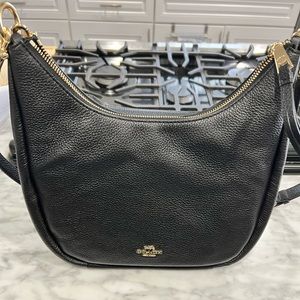 Brand new black Coach Purse still in wrapper.
